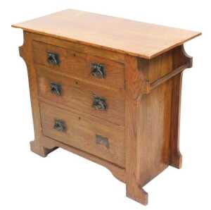 A Victorian Arts and Crafts oak chest, of three drawers, flanked by towel rails, raised on...