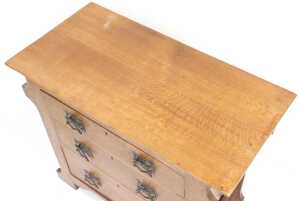 A Victorian Arts and Crafts oak chest, of three drawers, flanked by towel rails, raised on... - 2