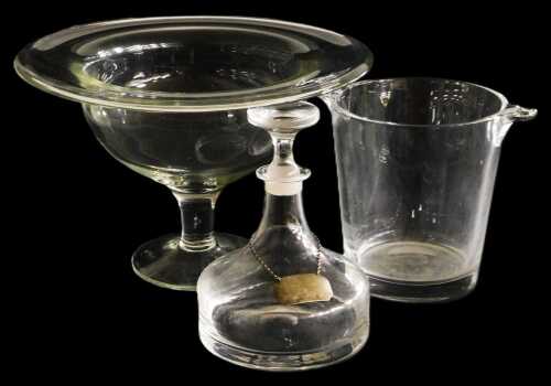 A glass pedestal bowl, on a domed foot, 22cm high, 34.5cm diameter, a glass wine cooler, and a...