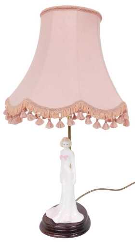 A Coalport porcelain Silhouettes Lydia figural table lamp, the tasselled pink fabric shade,...