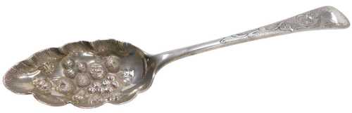 A George III silver fruit spoon, the bowl embossed with fruit, and a floral and foliate engraved...