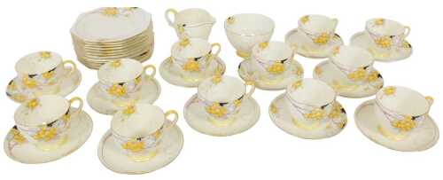 A Paragon porcelain Goldenball pattern tea service, comprising cream jug and sugar bowl, twelve...