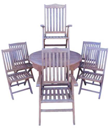 A hardwood extending garden table, with circular slatted top, 120cm diameter, and a set of six...