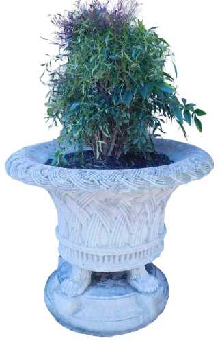 A large composition stone garden urn, the top, border and sides with interwoven design, on four...