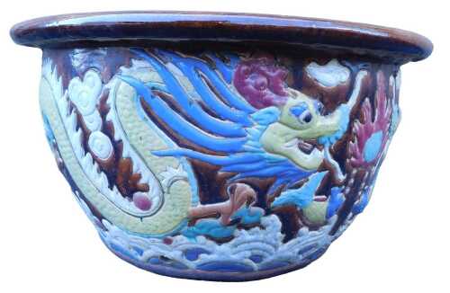 A large Chinese brown glazed jardiniere, decorated with a multicoloured dragon, etc., 38cm high,...