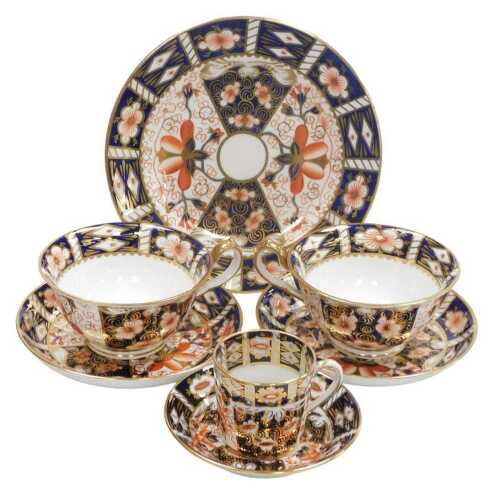 A group of Royal Crown Derby Imari porcelain tea wares, pattern no. 2451, comprises a pair of...
