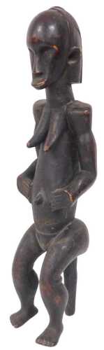 An African Fang tribal fertility doll, in the standing position, 56cm high.