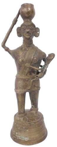 An Indian Dhokra bronze figure of a lady with child, on a tapering base, 24cm high.