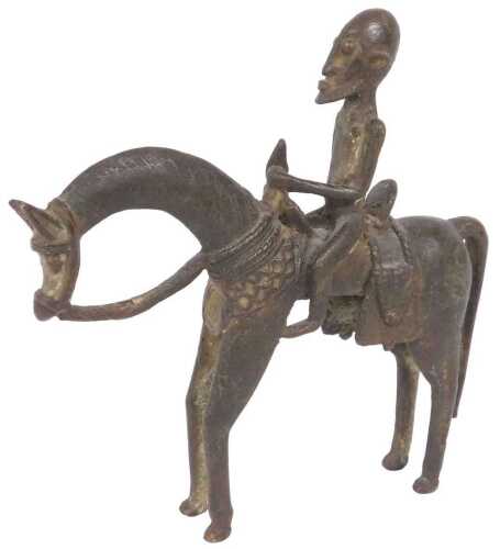An African Dogon bronze tribal figure of a man on horseback, 22.5cm high, 22cm wide.
