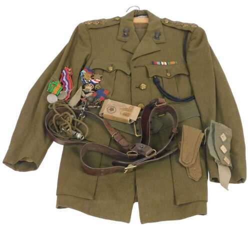 A WWII period Royal Artillery captain's uniform, with pips, buttons and badges, from Joseph...