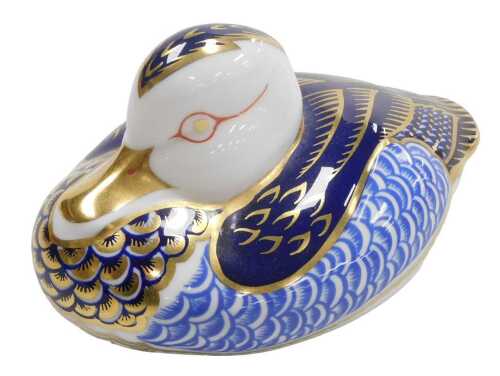 A Royal Crown Derby Imari porcelain paperweight, modelled as an Eider duck, gold stopper,.