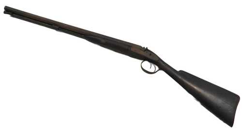 An antique muzzle loaded side by side shotgun.