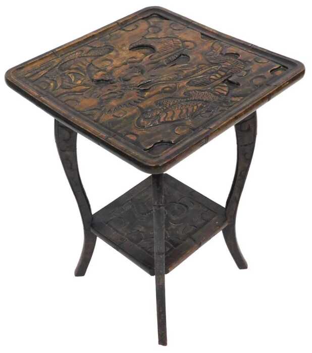 An early 20thC carved Japanese hardwood table, for Liberty's of London, the square top carved...