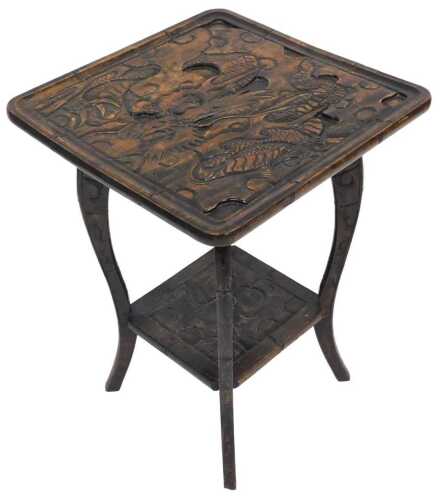 An early 20thC carved Japanese hardwood table, for Liberty's of London, the square top carved...