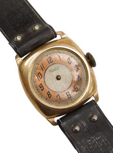 A Rolex 9ct gold cased wristwatch, circular silvered dial with copper coloured chapter ring...