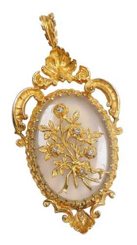 A Victorian style 9ct gold chalcedony and diamond pendant, the oval chalcedony overlaid with a...