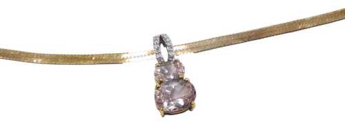 A 9ct gold morganite and diamond pendant, with two graduated oval cut morganites below a diamond...
