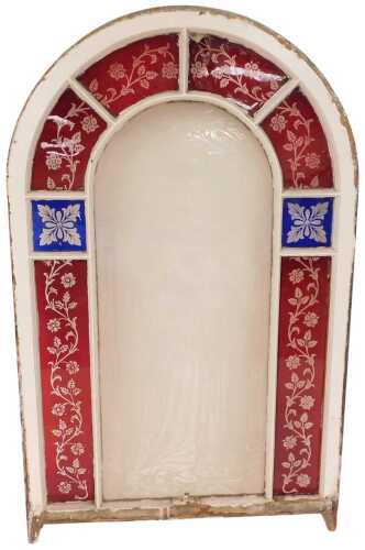 A Victorian stained and etched glass window, of arched form in a white painted pine frame, the...