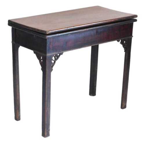 A George III mahogany tea table, the rectangular top hinged to reveal a polished interior, on...