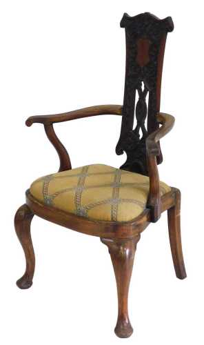 An early 20thC walnut side chair, the pierced narrow back with a central shield shaped vacant...