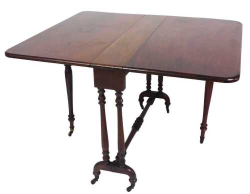 A Victorian walnut Sutherland table, the rectangular top with a moulded edge, on turned end...