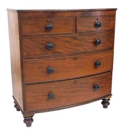 A Victorian mahogany bow fronted chest of drawers, with two short and three long drawers, each...