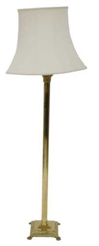 A brass Corinthian column floor lamp, on a square base with paw feet, with a cream coloured...