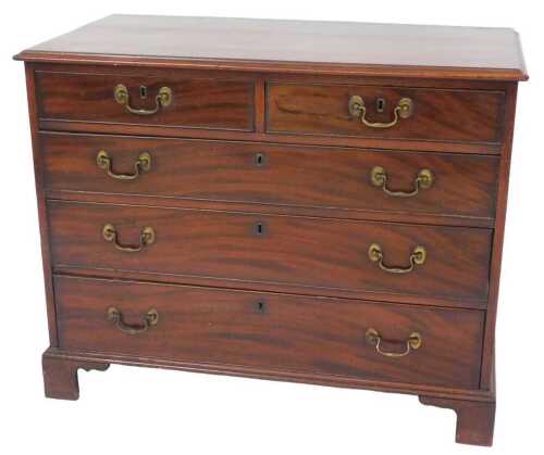 An early 19thC mahogany chest of drawers, the rectangular cross banded top with a moulded edge,...