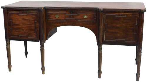 A George III Hepplewhite style mahogany break front sideboard, with a central frieze drawer...