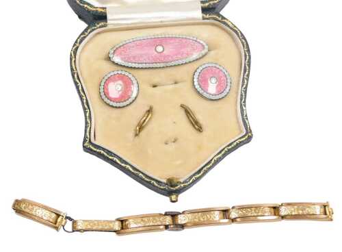 A George V silver and pink and white pique enamel lady's brooch and button set, one button...
