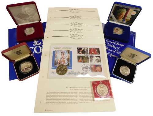 A group of Royal commemorative coins, including The Royal Family coin covers, Danbury Mint...