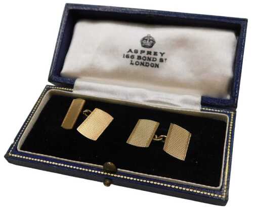 A pair of rectangular double chain link cufflinks, with engine turned decoration, yellow metal,...