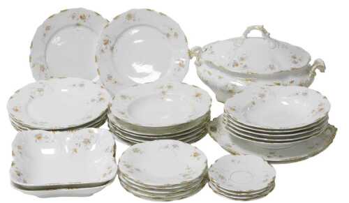 A late 19thC Continental porcelain part dinner service, possibly Limoges, decorated with floral...