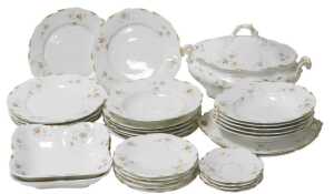 A late 19thC Continental porcelain part dinner service, possibly Limoges, decorated with floral...