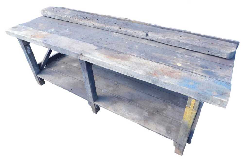 Form Work Bench A 20thC heavy wooden workbench, of rectangular form, with undertier and ...