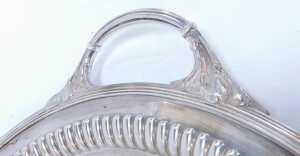 An Edward VII silver twin-handled tray, of oval form, with leaf decoration to each handle, and... - 2