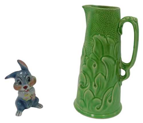 A Ridgway relief moulded green glaze jug, of cylindrical tapering form, decorated with leaves,...