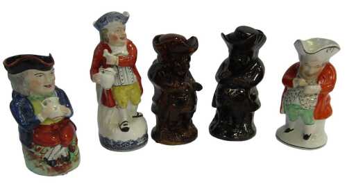 A group of Toby jugs, to include a Staffordshire style Hearty Good Fellow jug, 29cm high, two...