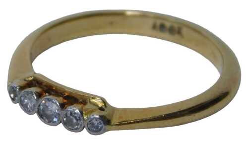 A diamond five-stone dress ring, the five tiny diamonds each in a rub over platinum setting, on...