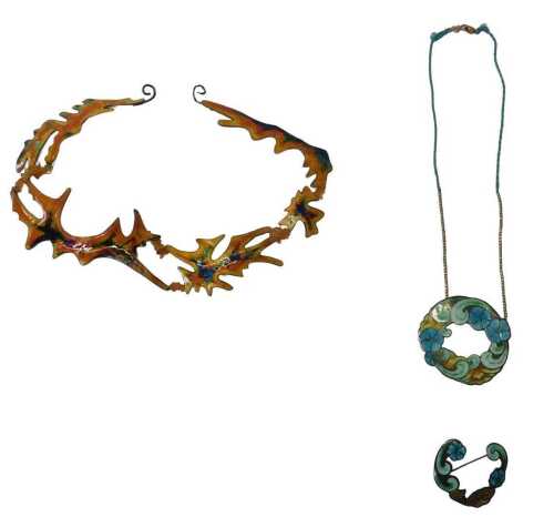 A group of enamel jewellery, comprising a Dorothy May Budd silver and orange enamel abstract...