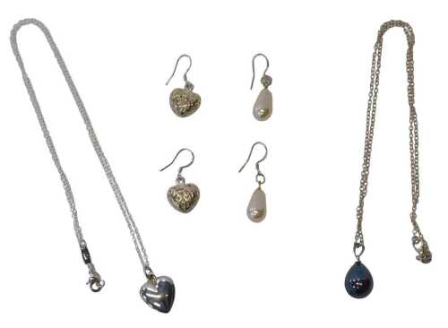 A group of silver jewellery, comprising two pairs of drop earrings, pierced heart-shaped baskets,...