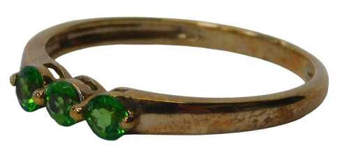 A 9ct gold QVC three stone dress ring, set with three sphene stones, each round brilliant cut,...