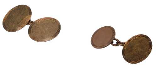 A pair of 9ct rose gold oval cufflinks, each oval with a ribbed border, on a chain link,...