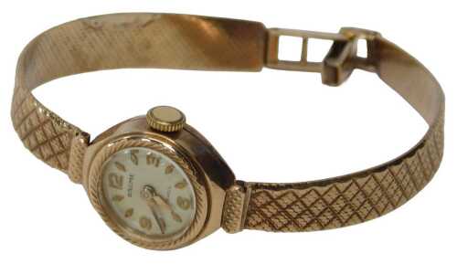 A Baume 9ct gold lady's cocktail watch, with a silvered numeric and batoned dial, 1cm wide, on a...