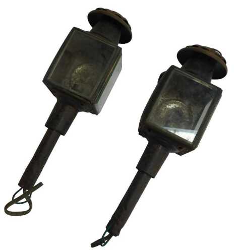 A pair of Victorian black painted tin coaching lamps, converted to electricity, 40cm high.
