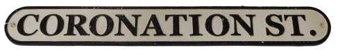 A Coronation Street painted cast iron sign, of rectangular form with rounded edges, 59cm long.