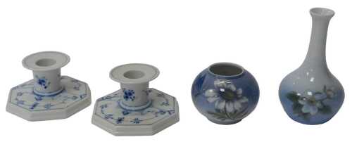 Two Royal Copenhagen porcelain squat candlesticks, decorated with blue flowers against a white...