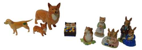 A group of pottery figures, to include a Beswick Corgi, 14cm high, and another 7cm high, a Royal...