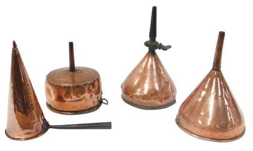 A group of Victorian copper, to include an ale muller, two funnels, one with a tap, and another....