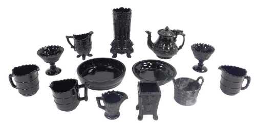 A group of Victorian black pressed glass, some possibly Sowerby, to include a cylindrical vase,...